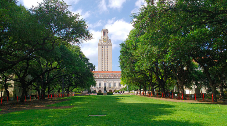 UT Austin's tower surrounded by trees.