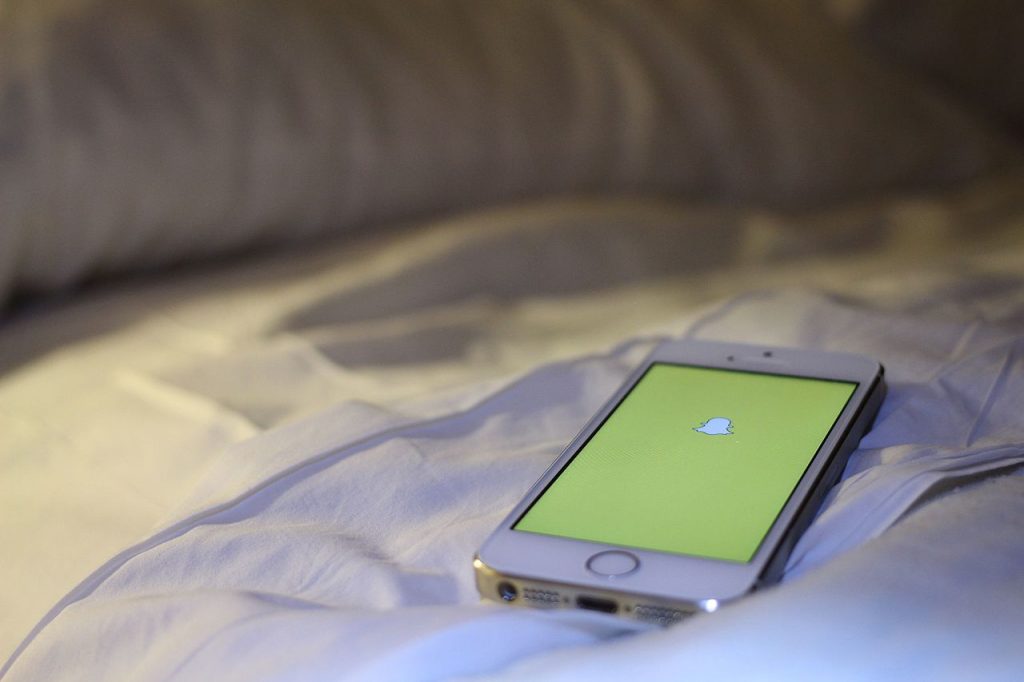 Snapchat logo displayed on a phone