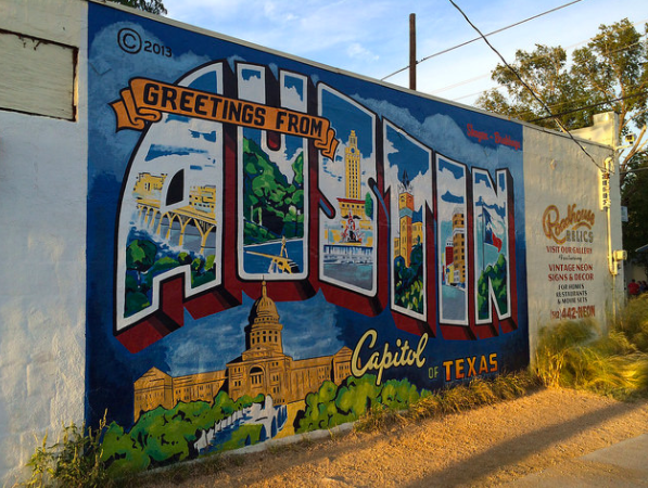 Colorful Austin sign filled with city-related images like the Capitol or UT Tower